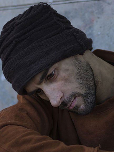 Original photo of a young man in thoughtful posture, used to create personalized pencil drawing poster and realistic sketch wall art print.